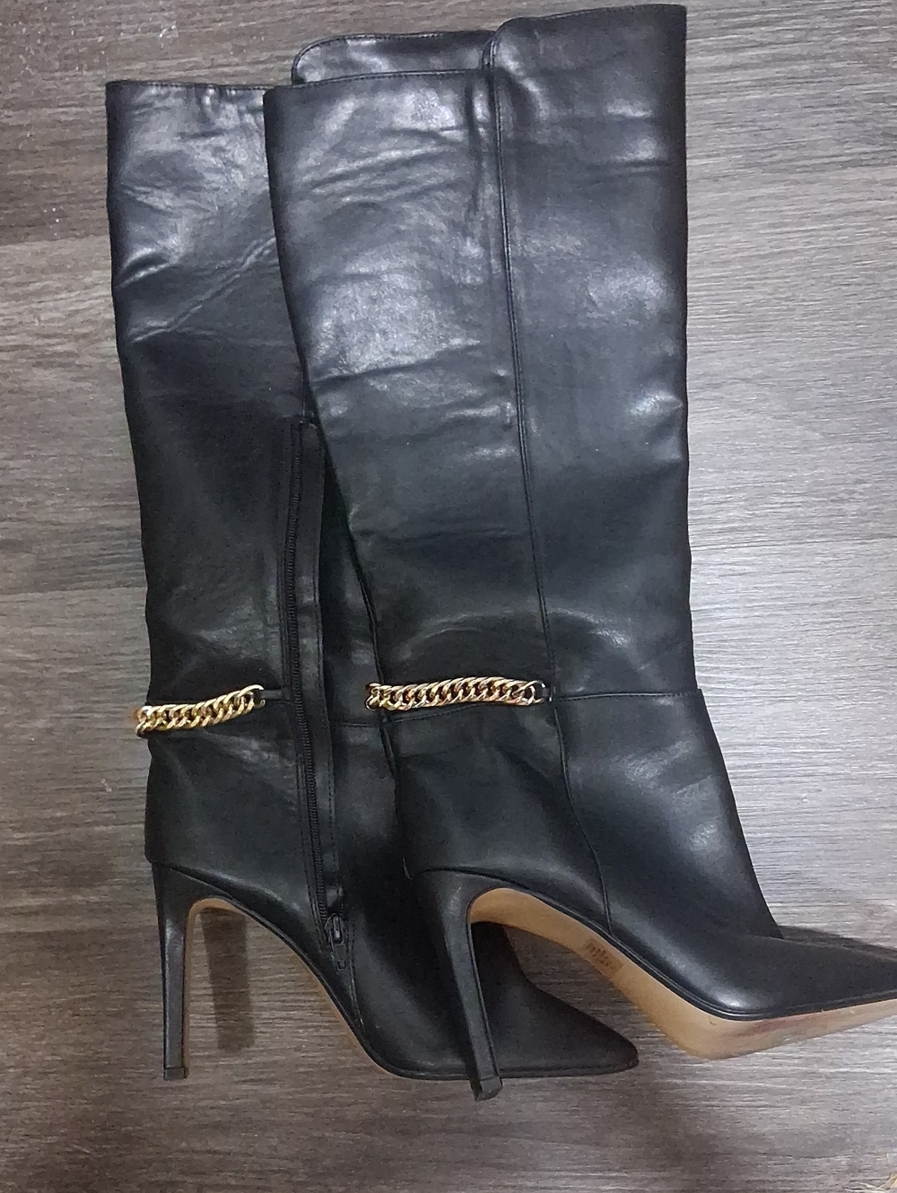 Express Black Leather Knee-High Stiletto Boots with Gold Chain